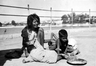 Bombay beggar family 1945 by Harry Turner