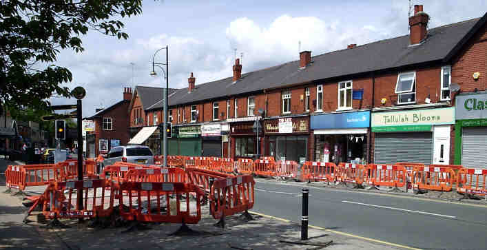 The array of barrier around the pavement replacement job in the centre of Romiley, 2007/05/20