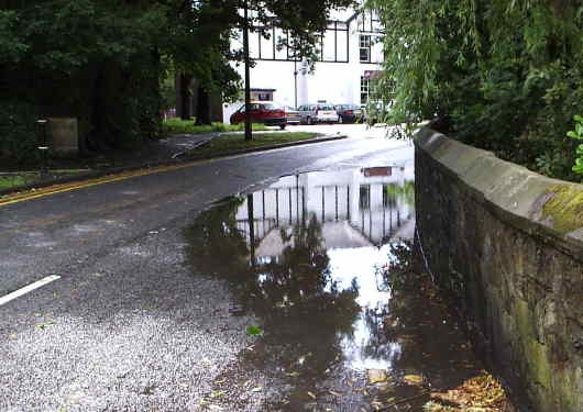 The Liberal Club reflected in a vast puddle, Romiley 2007/06/15